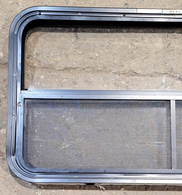 Used Black Radius Opening Window : 41 1/4" W x 21 1/4" H x 1 3/4" D - Young Farts RV Parts