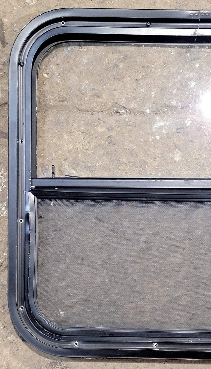 Used Black Radius Opening Window : 23 1/2" W x 21 1/4" H x 1 1/4" D - Young Farts RV Parts