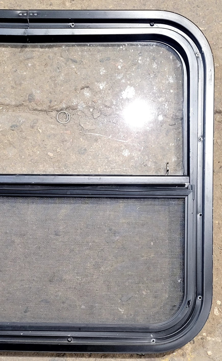 Used Black Radius Opening Window : 23 1/2" W x 21 1/4" H x 1 1/4" D - Young Farts RV Parts
