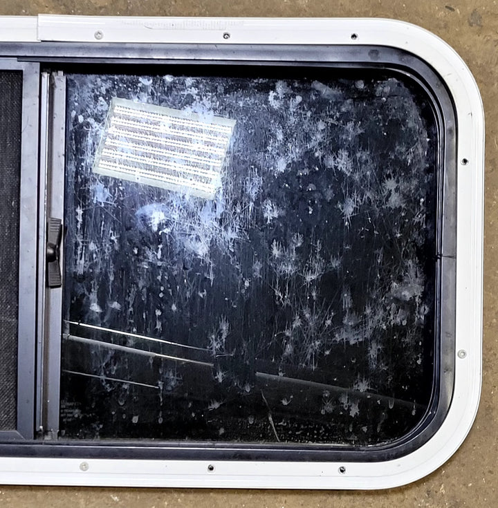 Used Black Radius Opening Window : 31 1/2" W x 15 1/4" H x 1 1/8" D - Young Farts RV Parts