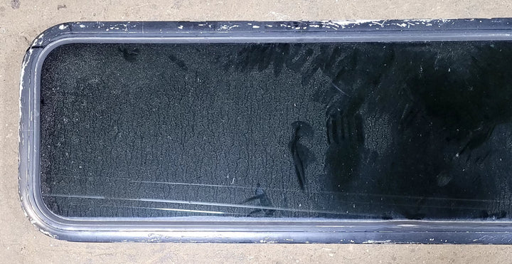 Used Black Radius Non Opening Window : 51 1/2" W x 14 1/4" H x 1" D - Young Farts RV Parts