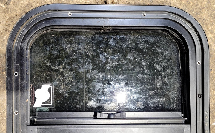 Used Black Radius Opening Window : 17 1/2" W x 14 1/4" H x 1 1/4" D - Young Farts RV Parts