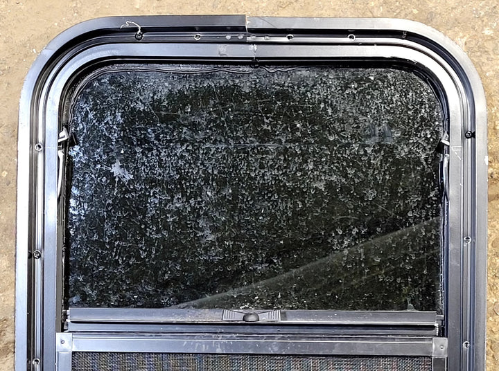 Used Black Radius Opening Window : 17 1/2" W x 21 1/2" H x 1 3/4" D - Young Farts RV Parts