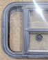 Used Black Radius Opening Window : 23 1/4" W x 15 1/4" H x 1 3/4" - Young Farts RV Parts