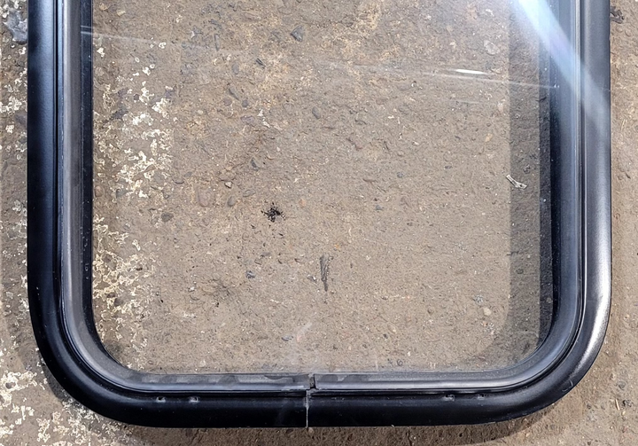 Used Black Radius Non Opening Window : 17 1/4" W x 22 1/4" H x 1 5/8" - Young Farts RV Parts