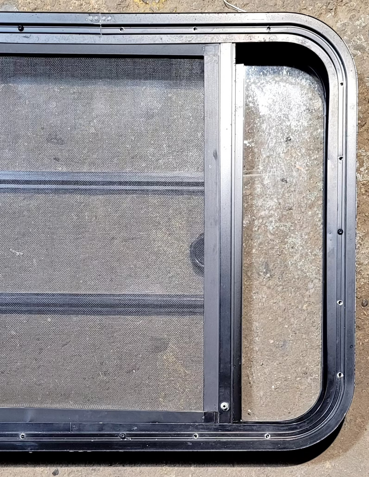 Used Black Radius Opening Window : 29 1/4" W x 22 1/4" H x 1 3/4" - Young Farts RV Parts