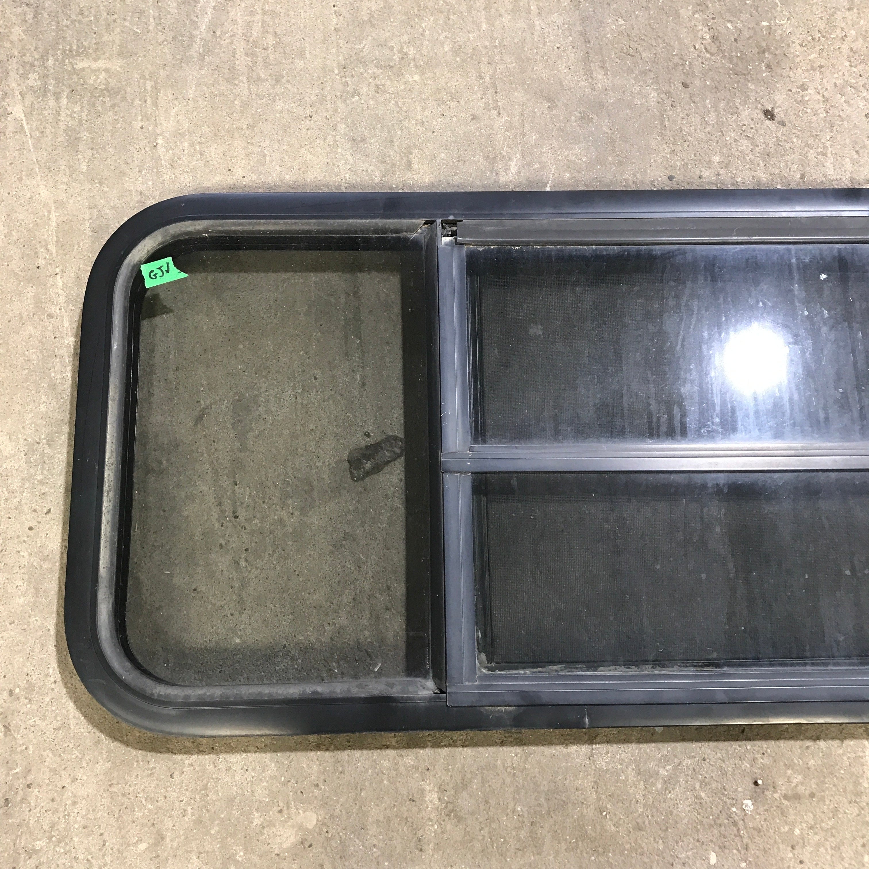 Used Black Radius Opening Window : 59.75" x 17.75" x 2" - Young Farts RV Parts