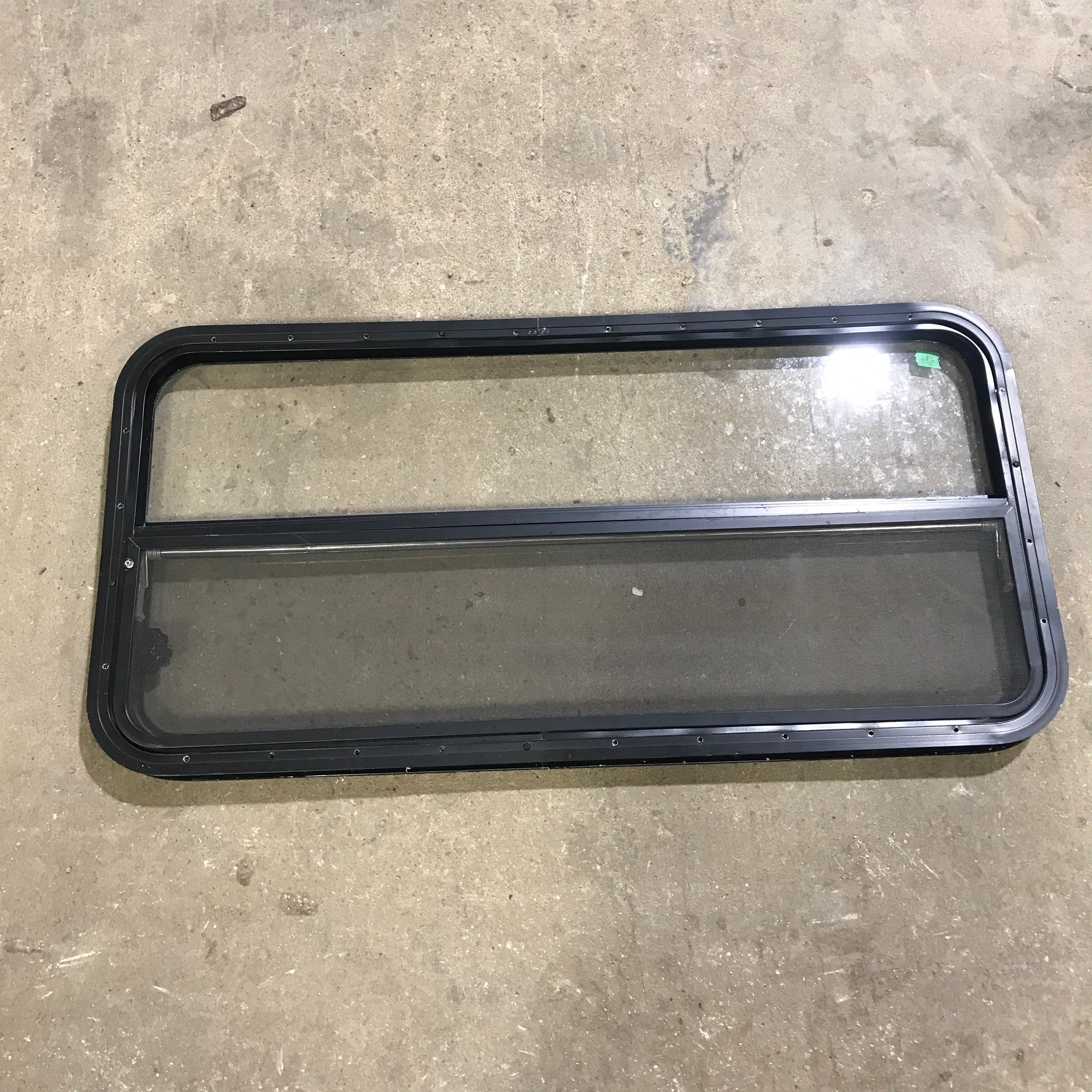 Used Black Radius Opening Window : 45.5" x 21.25" x 1.875" - Young Farts RV Parts