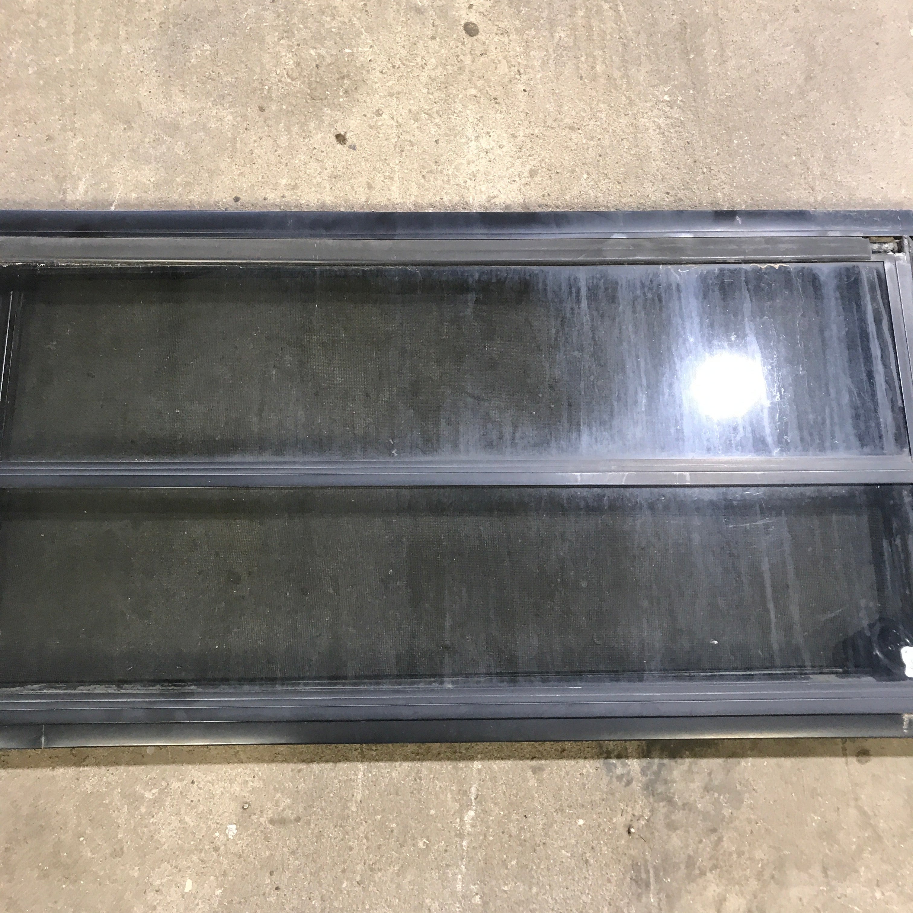 Used Black Radius Opening Window : 59.75" x 17.75" x 2" - Young Farts RV Parts