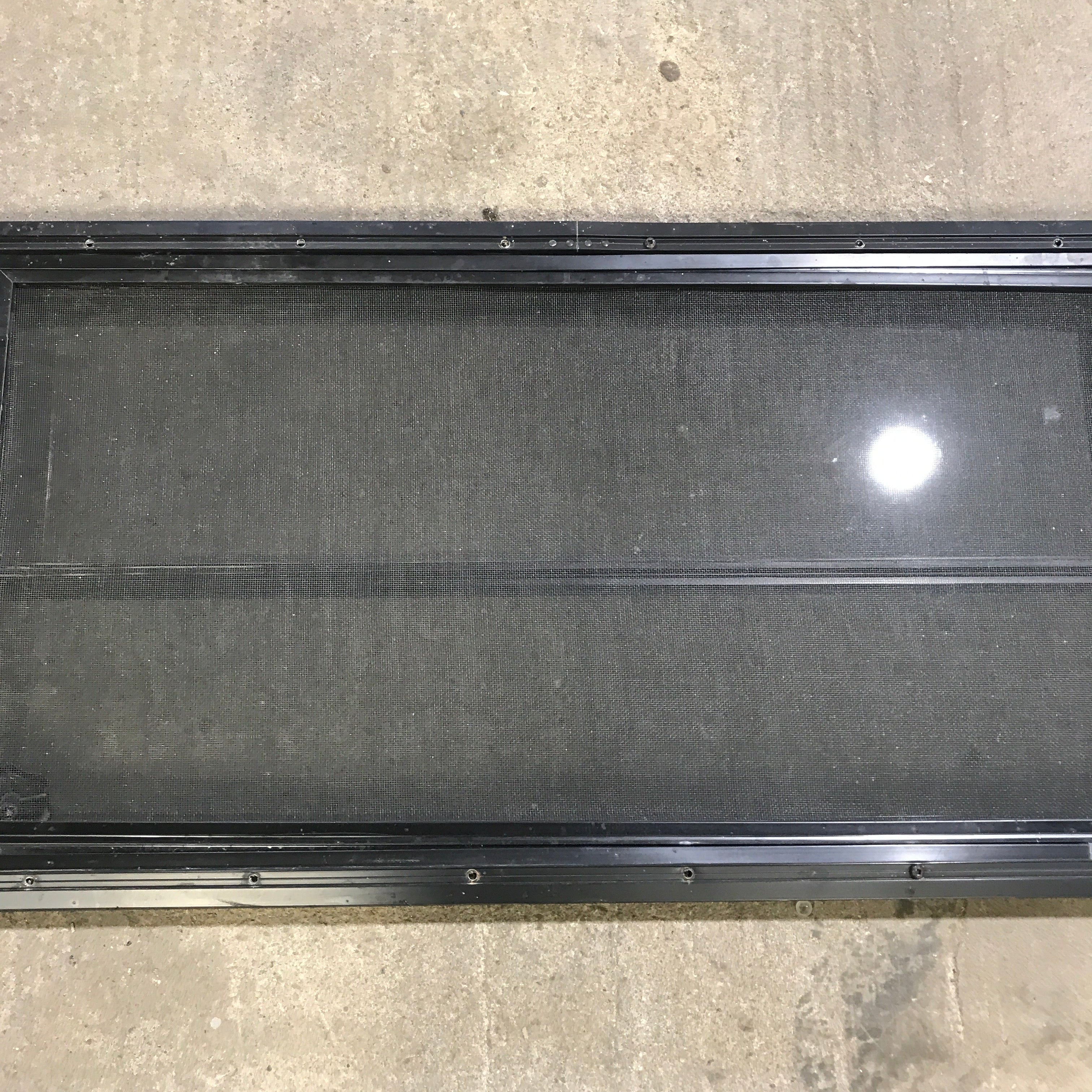 Used Black Radius Opening Window : 59.75" x 17.75" x 2" - Young Farts RV Parts