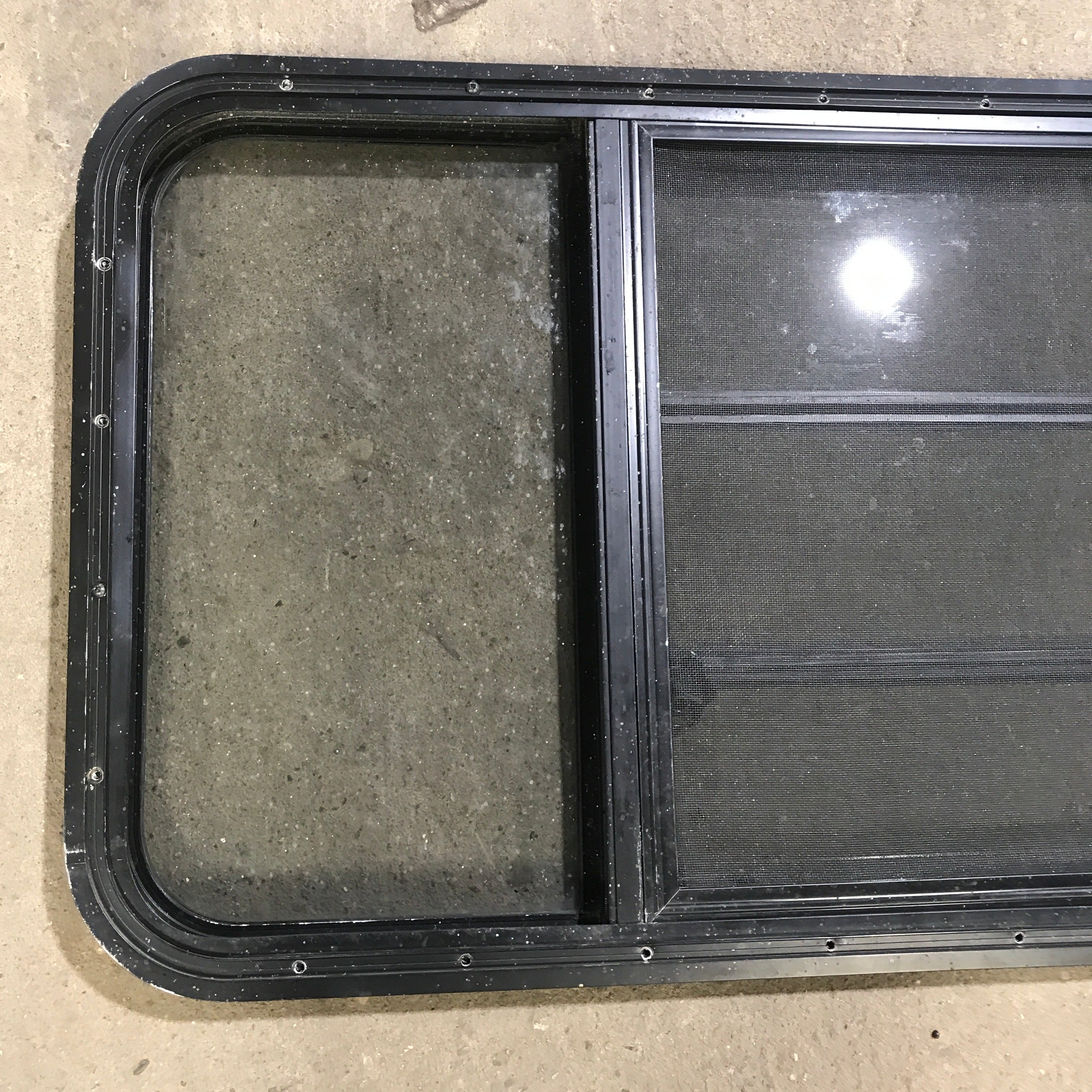 Used Black Radius Opening Window : 59.75" x 21.75" x 2" - Young Farts RV Parts