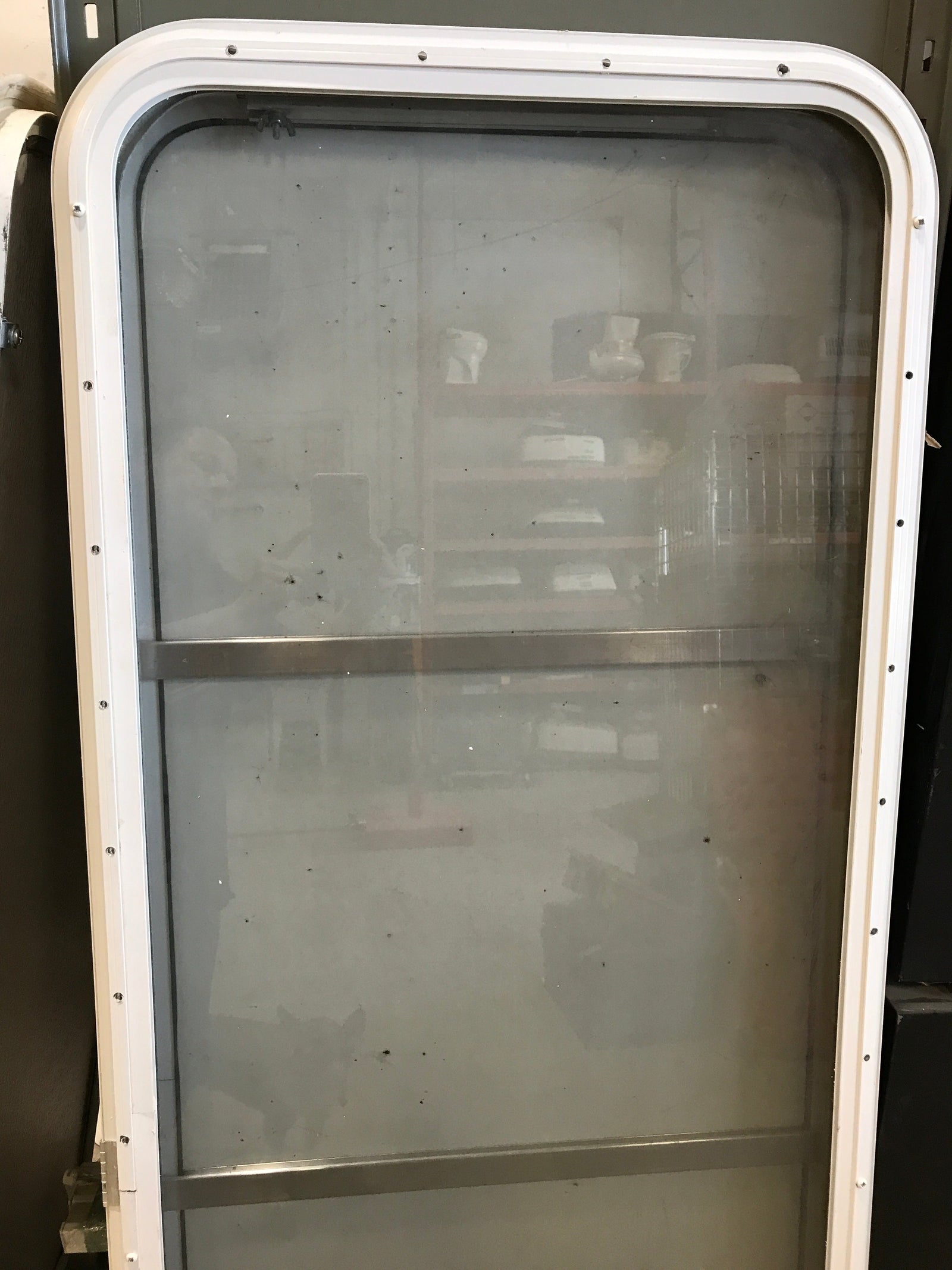 Used Radius Opening Rock Guard Covered Window: 59 1/2