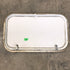 Used White Corner radius cargo door  23 3/4" W x 13 3/4" H x 1"D