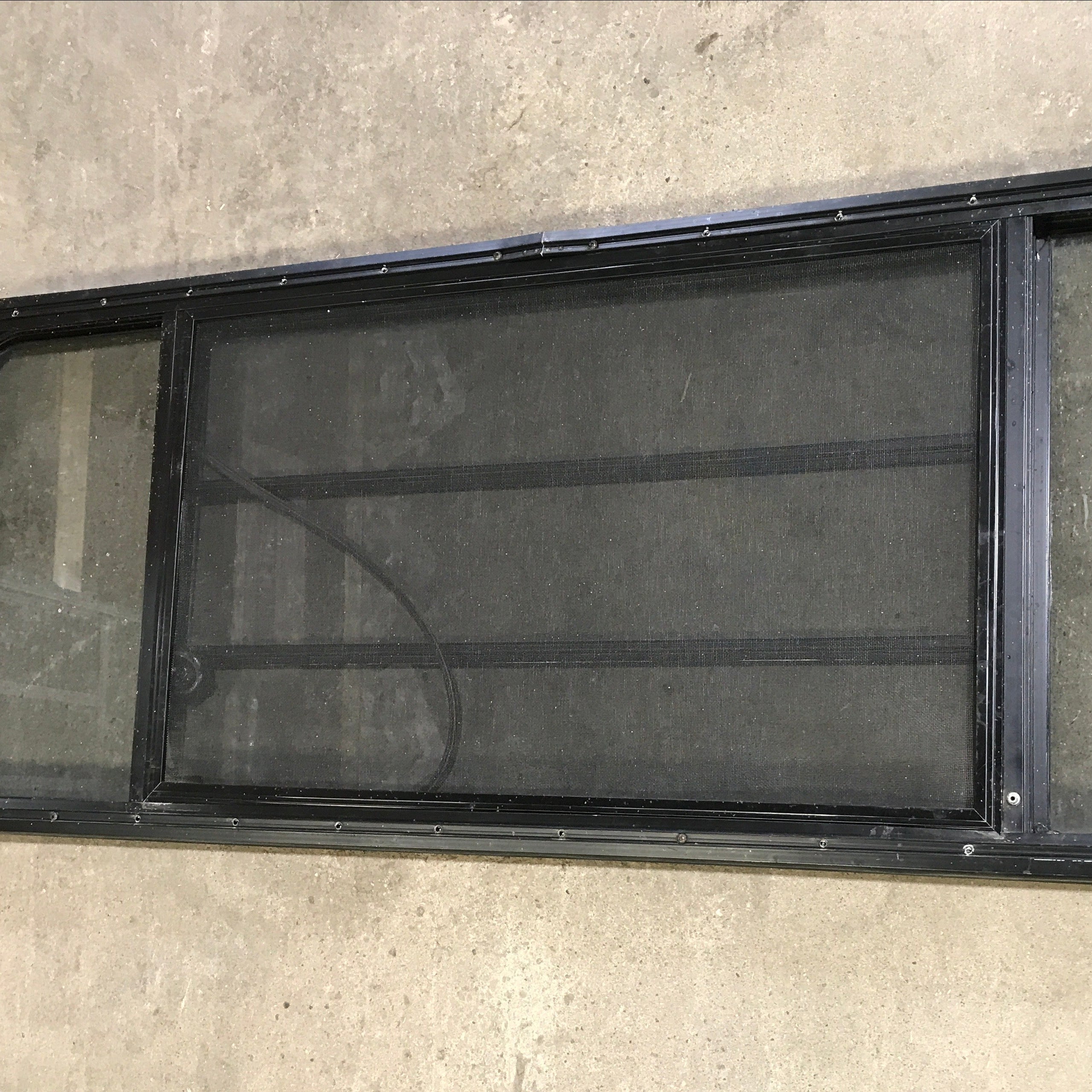 Used Black Radius Opening Window : 59.75" x 21.75" x 2" - Young Farts RV Parts