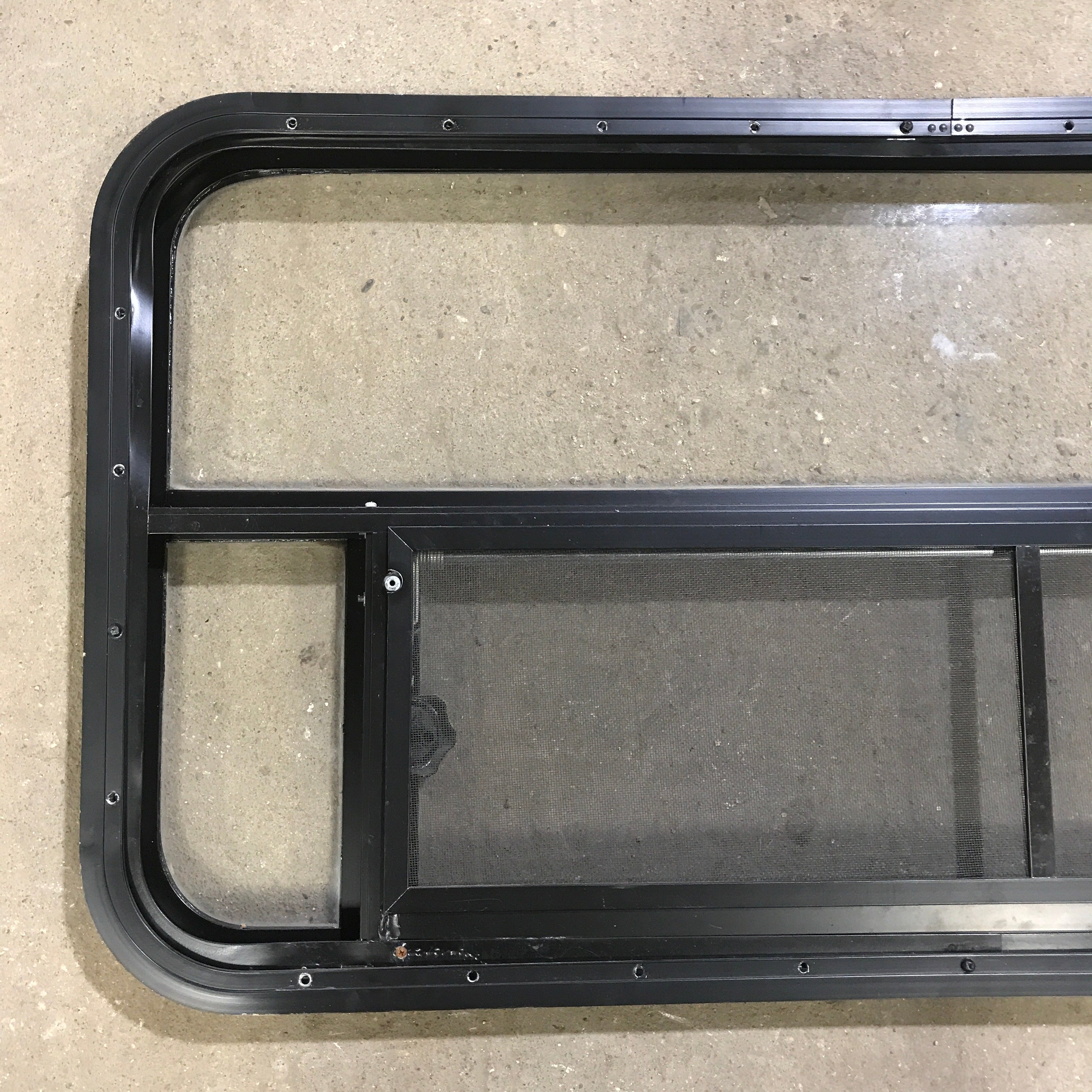 Used Black Radius Opening Window : 45.5" x 21.25" x 1.875" - Young Farts RV Parts