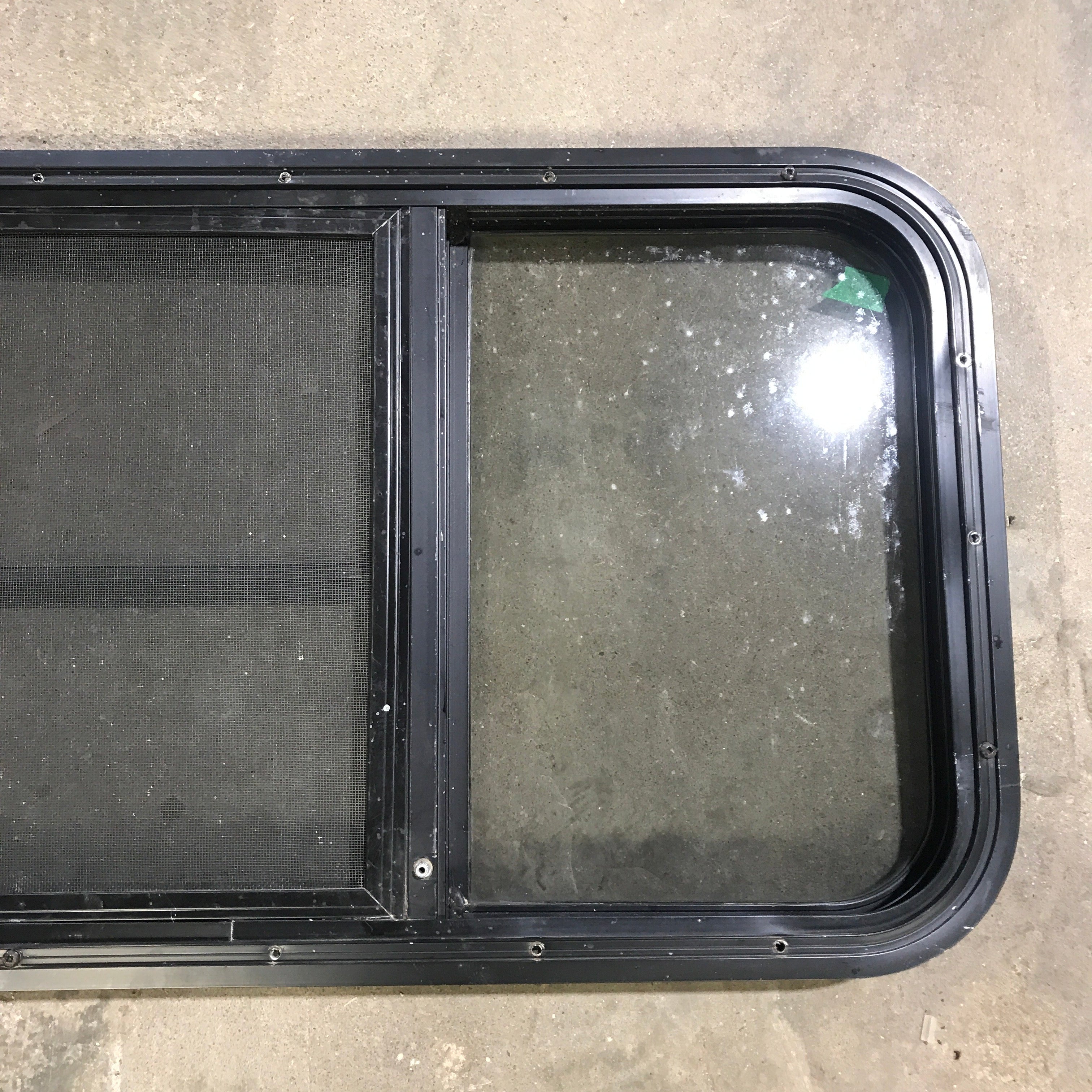 Used Black Radius Opening Window : 59.75" x 17.75" x 2" - Young Farts RV Parts