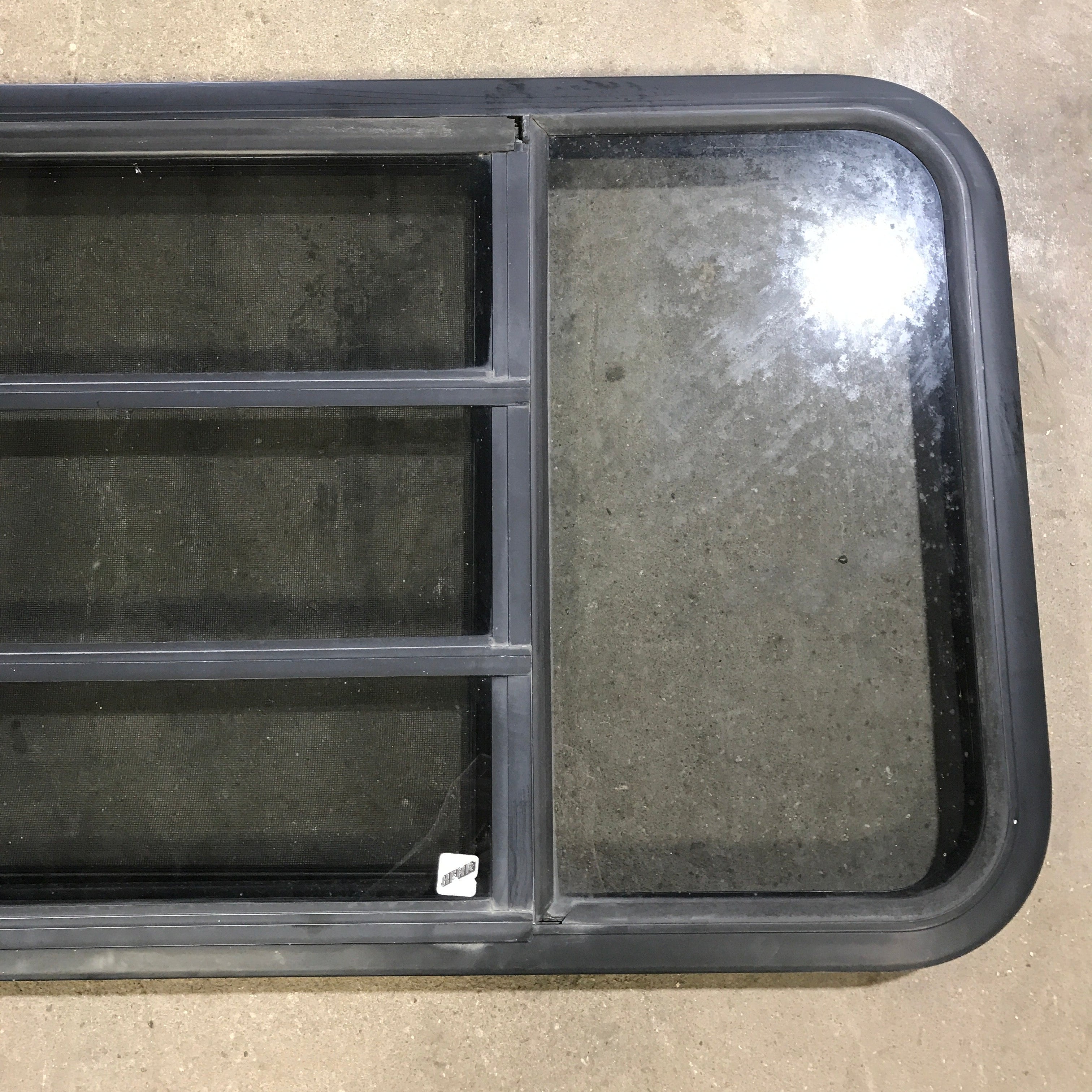 Used Black Radius Opening Window : 59.75" x 21.75" x 2" - Young Farts RV Parts