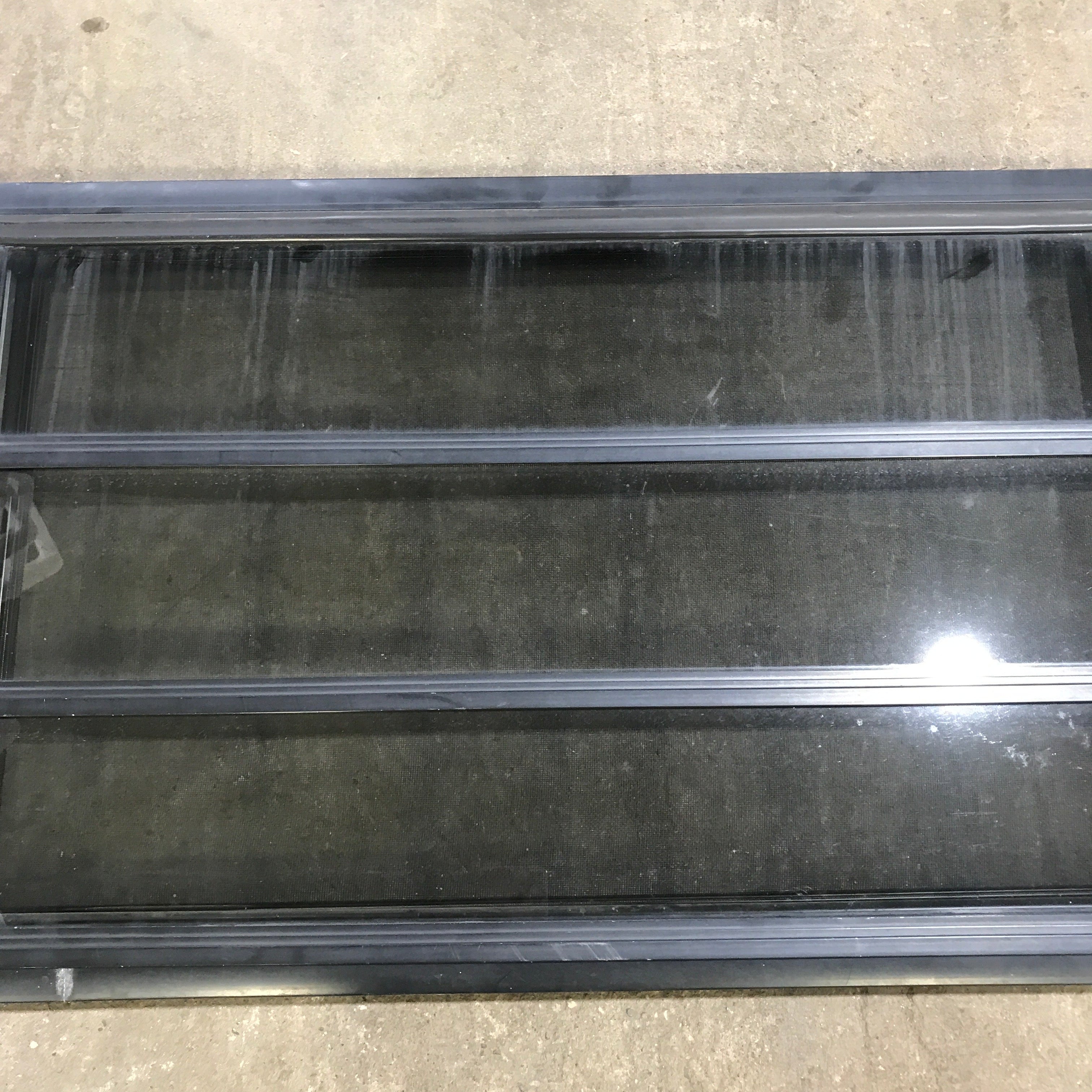 Used Black Radius Opening Window : 59.75" x 21.75" x 2" - Young Farts RV Parts