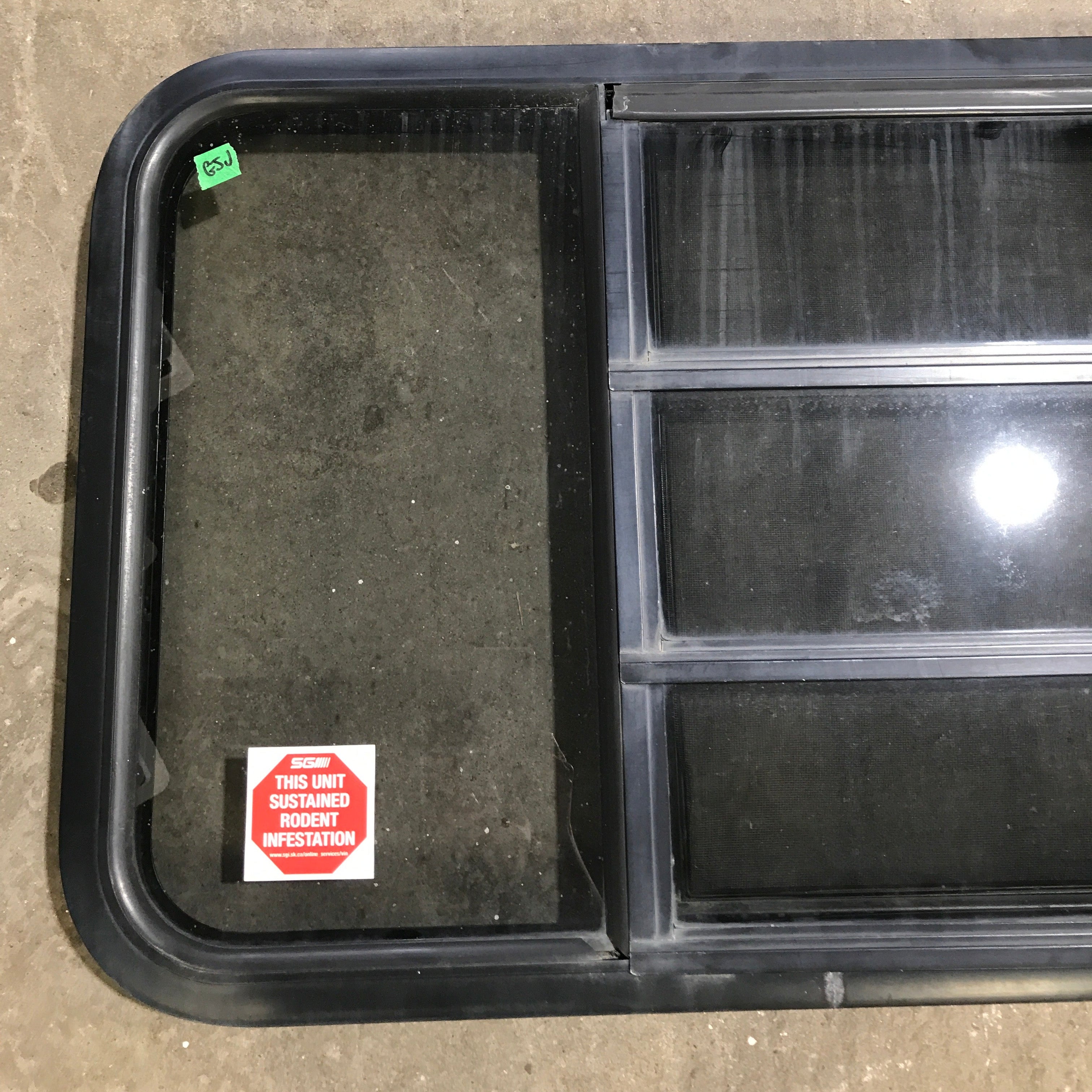 Used Black Radius Opening Window : 59.75" x 21.75" x 2" - Young Farts RV Parts