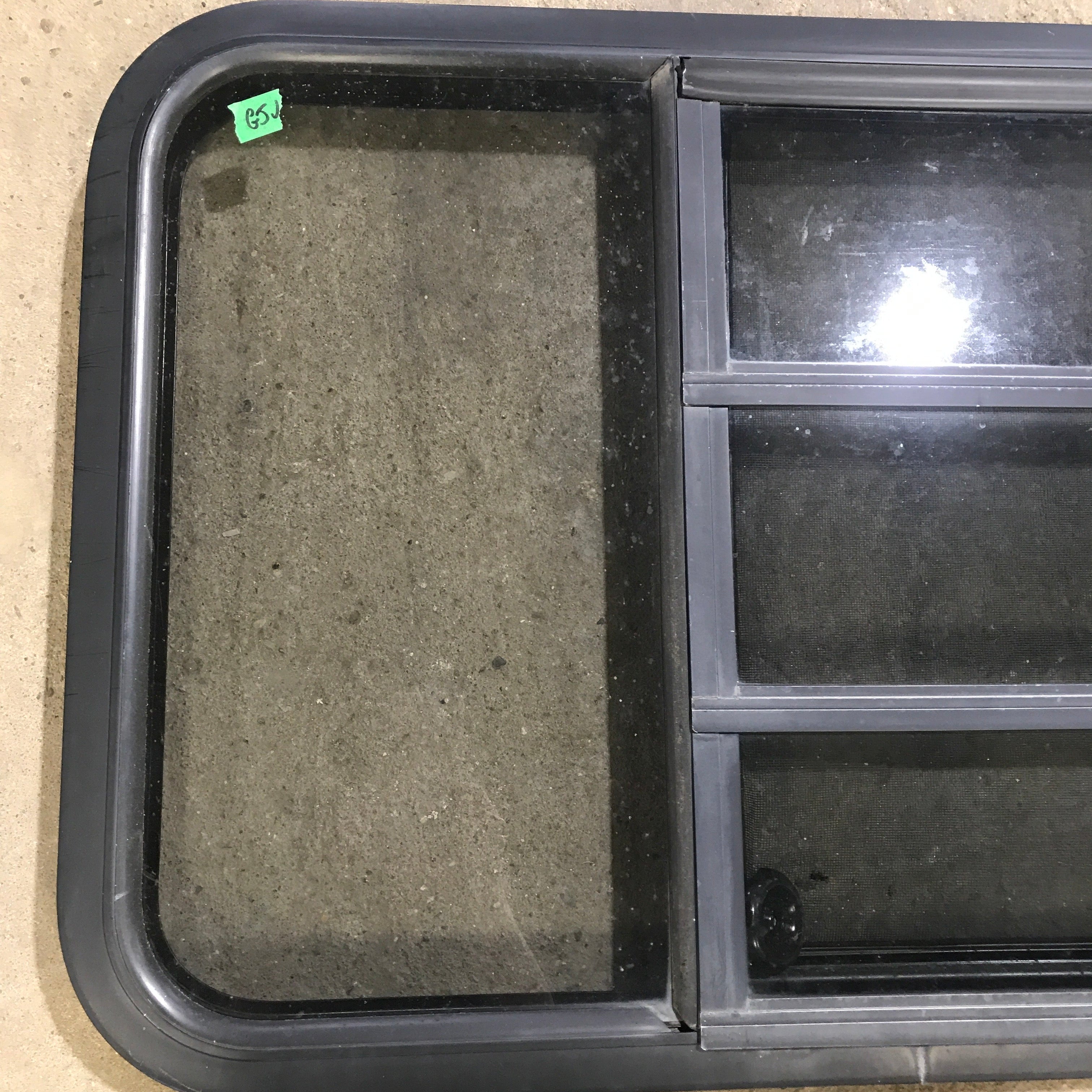Used Black Radius Opening Window : 59.75" x 21.75" x 2" - Young Farts RV Parts