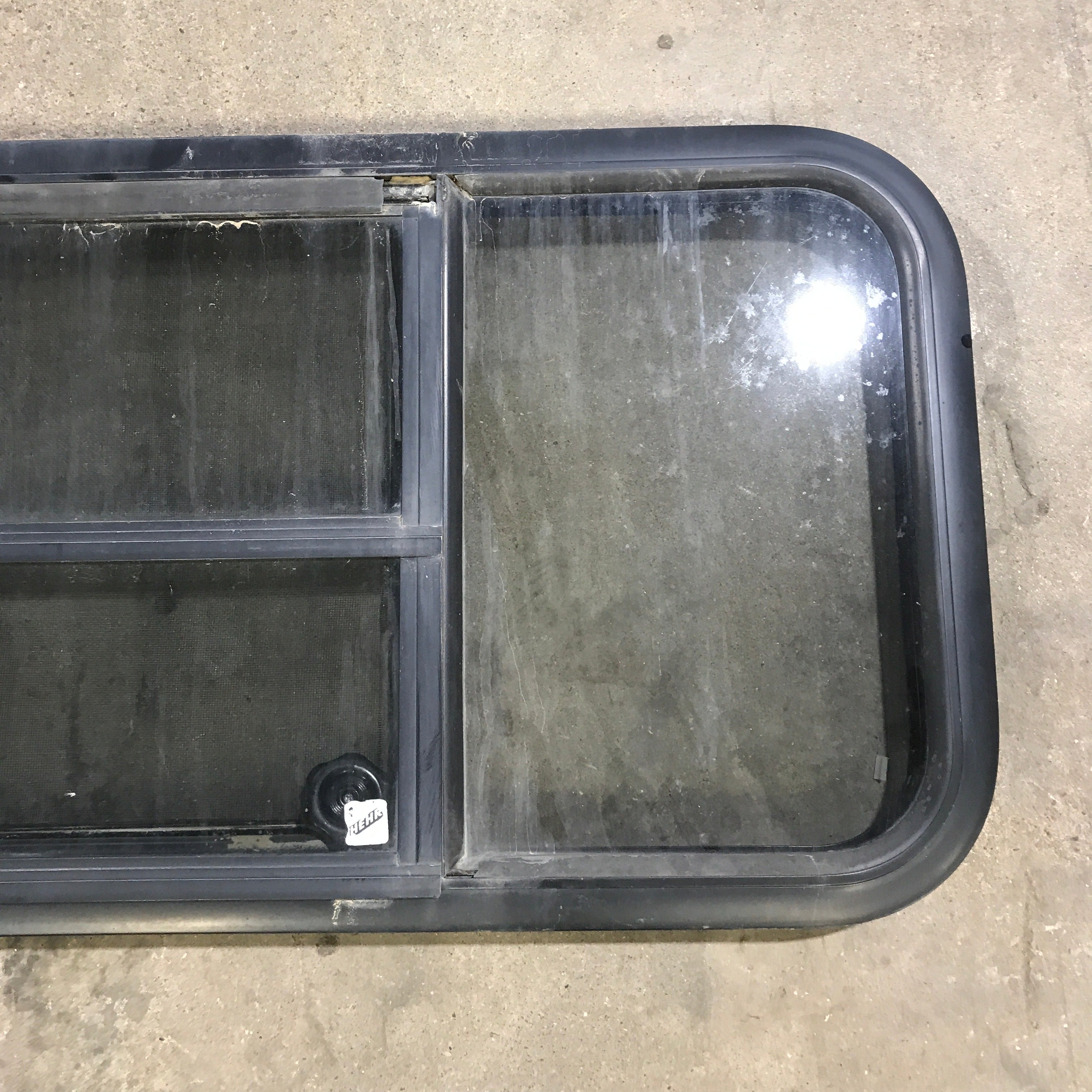 Used Black Radius Opening Window : 59.75" x 17.75" x 2" - Young Farts RV Parts
