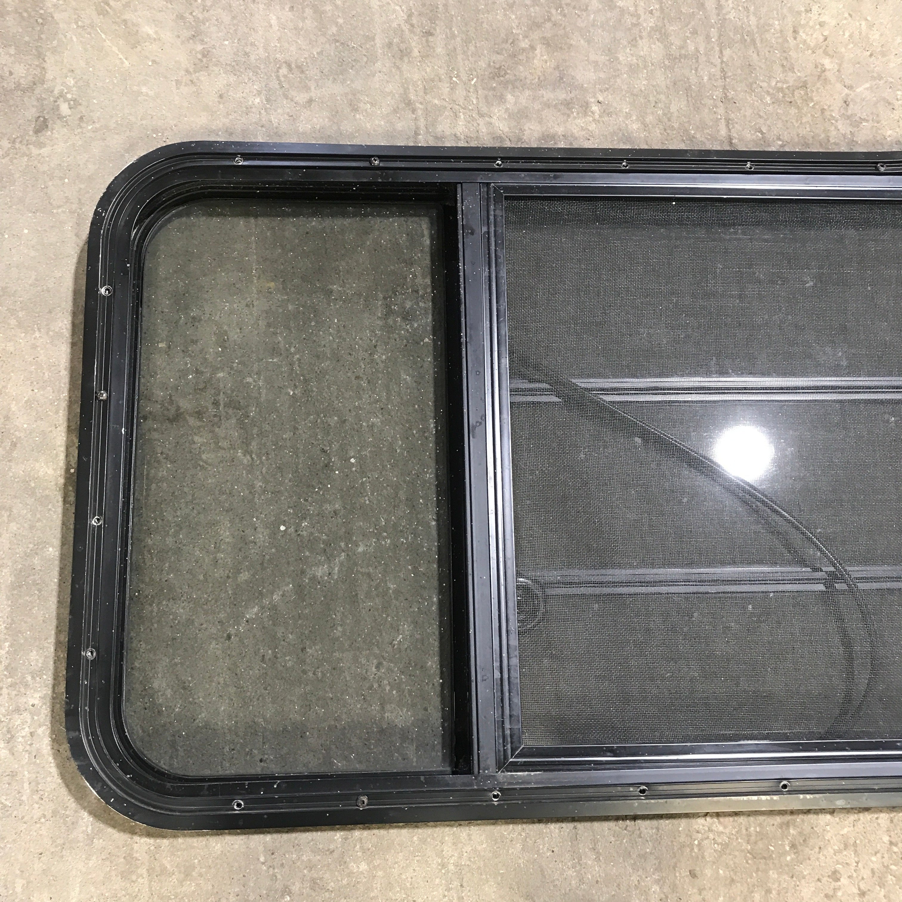 Used Black Radius Opening Window : 59.75" x 21.75" x 2" - Young Farts RV Parts