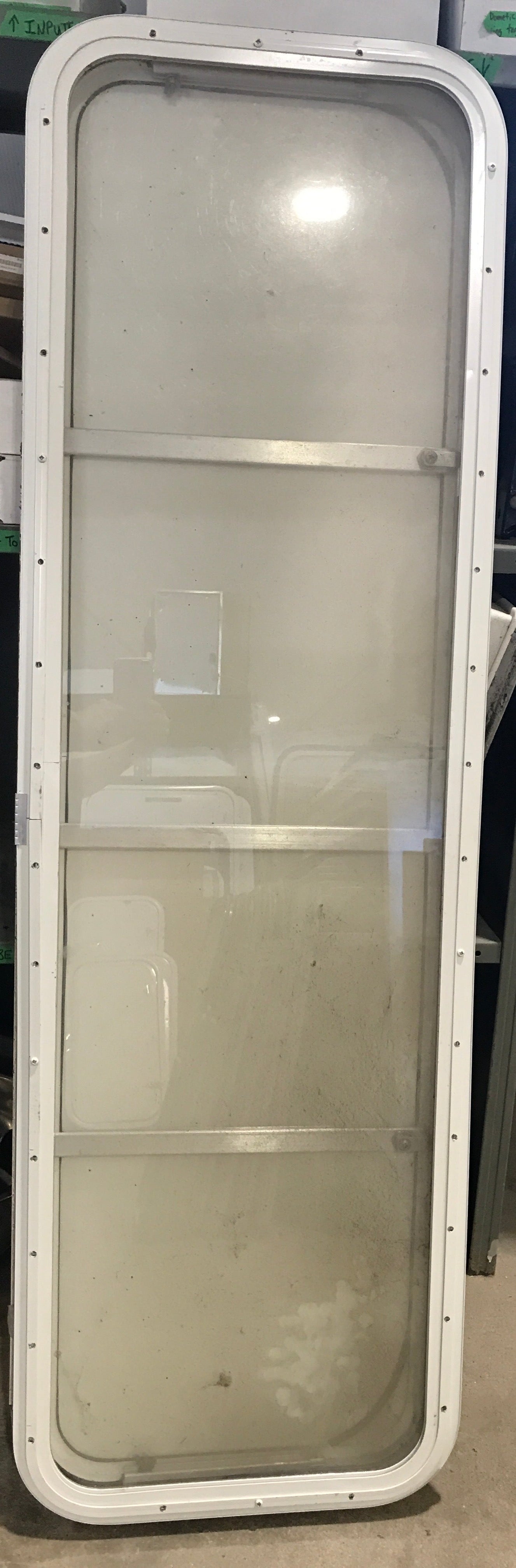 Used Radius Opening Rock Guard Covered Window: 59 1/2"  X 17 1/2"  X 1 1/2" D - Young Farts RV Parts