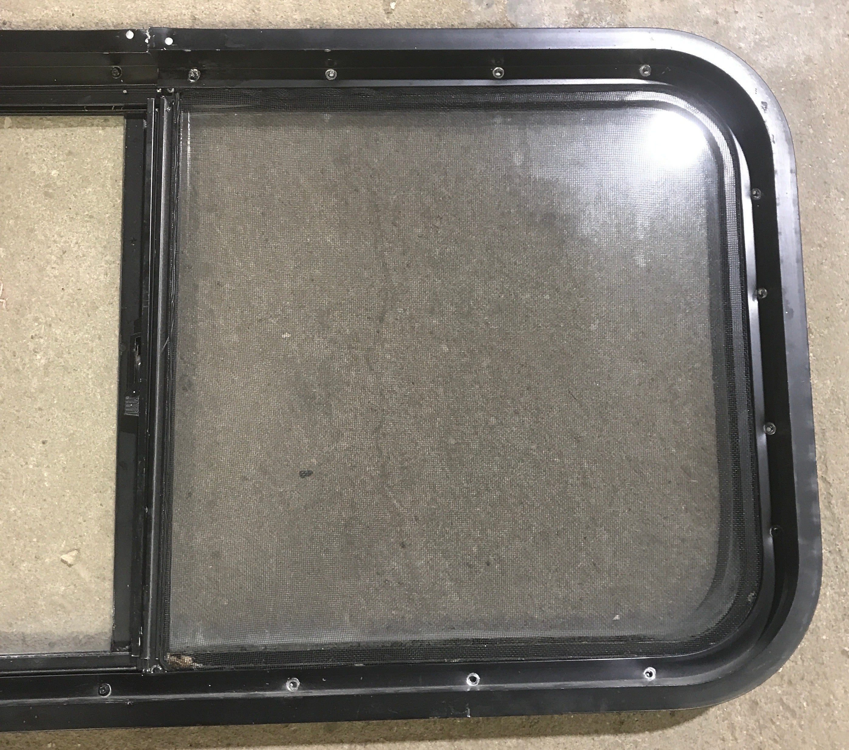 Used Slanted Black Radius Opening Window : 41 3/4" W x 17 1/2" H x 1 7/8" D - Young Farts RV Parts