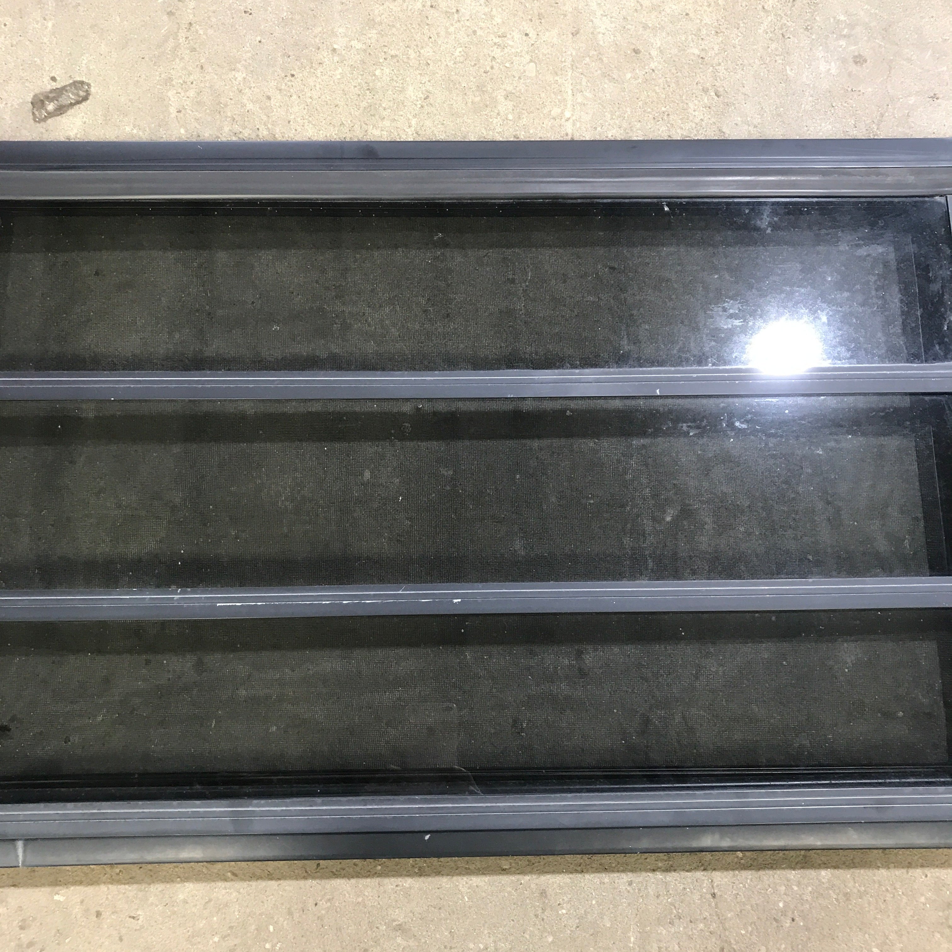 Used Black Radius Opening Window : 59.75" x 21.75" x 2" - Young Farts RV Parts