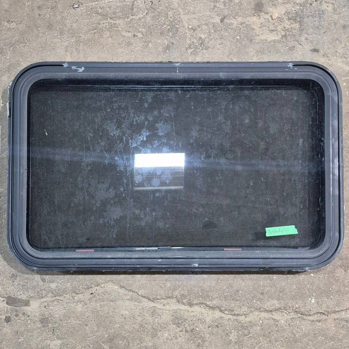 Used Black Radius Emergency Opening Window - 35 1/8" X 21 1/4" X 1 7/8" - Black Window