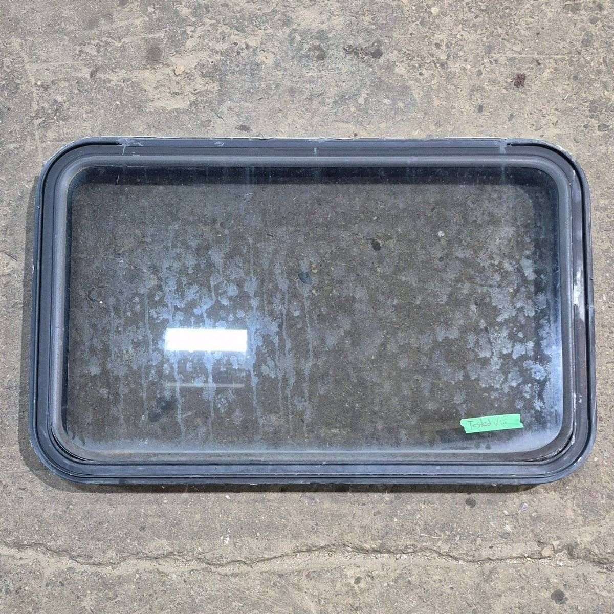 Used Black Radius Emergency Opening Window - 35 1/8" X 21 1/4" X 1 7/8" - Black Window