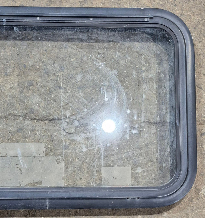 Used Black Emergency Radius Opening Window : 35 1/2" W x 18 3/4" H x 1 7/8" - Young Farts RV Parts