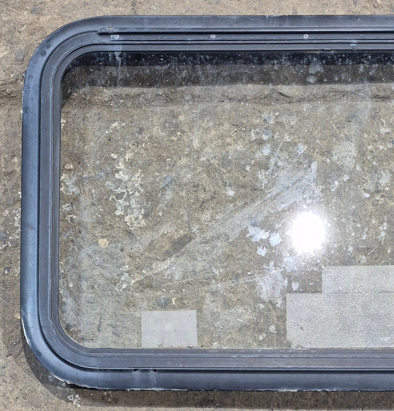 Used Black Emergency Radius Opening Window : 35 1/2" W x 18 3/4" H x 1 7/8" - Young Farts RV Parts