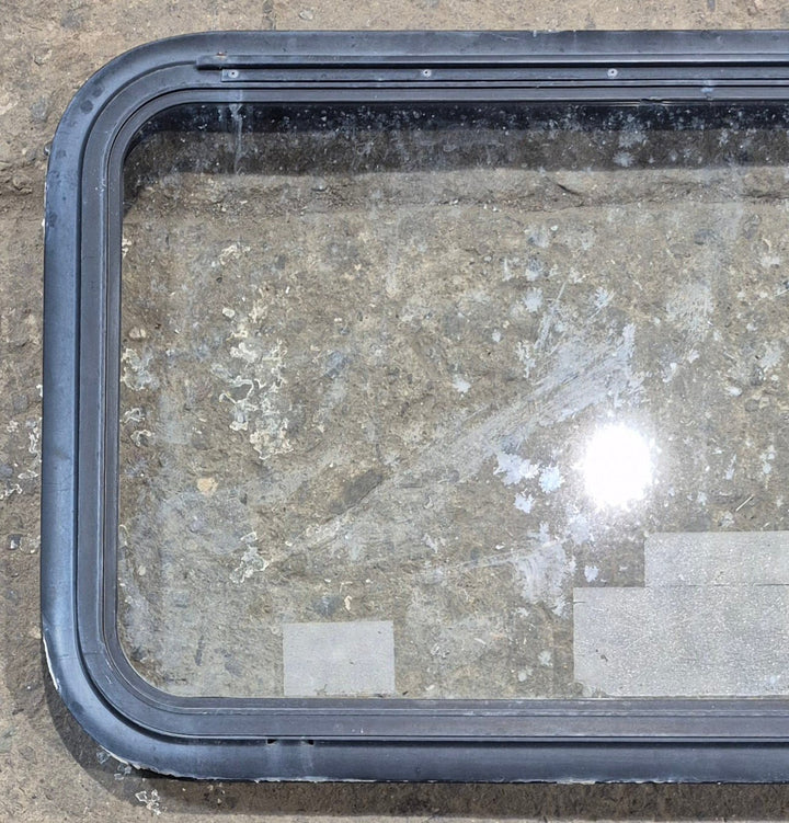 Used Black Emergency Radius Opening Window : 35 1/2" W x 18 3/4" H x 1 7/8" - Young Farts RV Parts