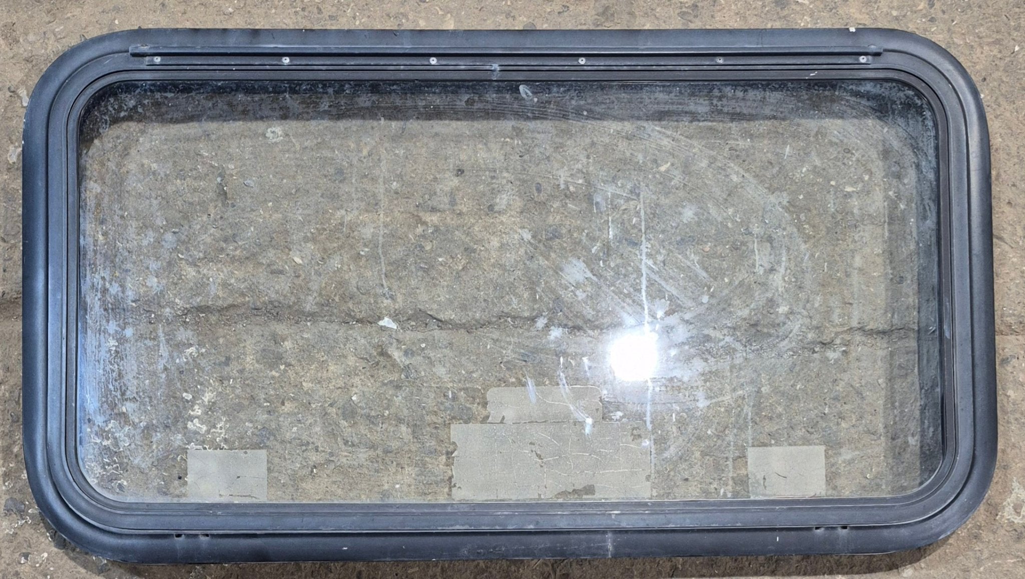 Used Black Emergency Radius Opening Window : 35 1/2" W x 18 3/4" H x 1 7/8" - Young Farts RV Parts