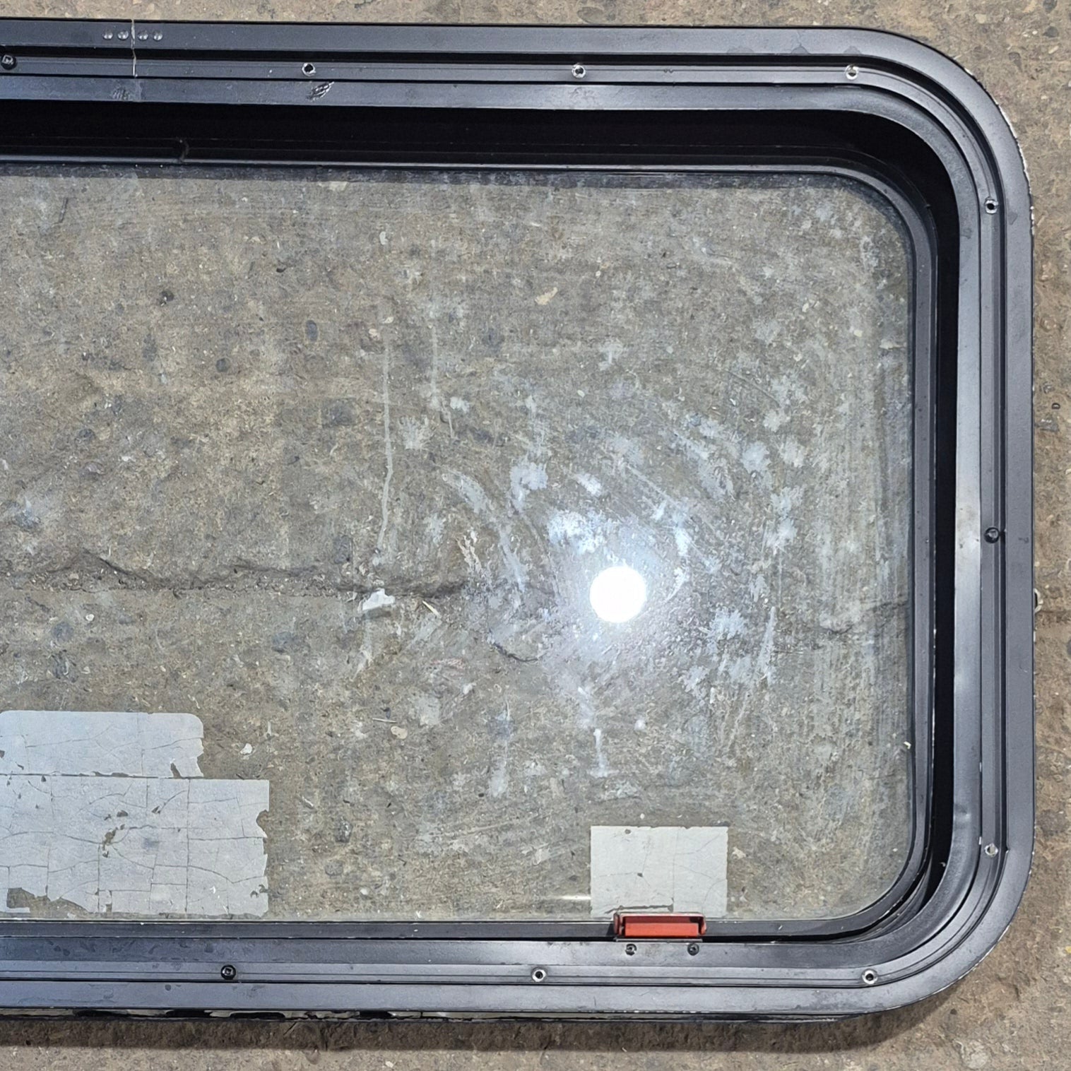 Used Black Emergency Radius Opening Window : 35 1/2" W x 18 3/4" H x 1 7/8" - Young Farts RV Parts