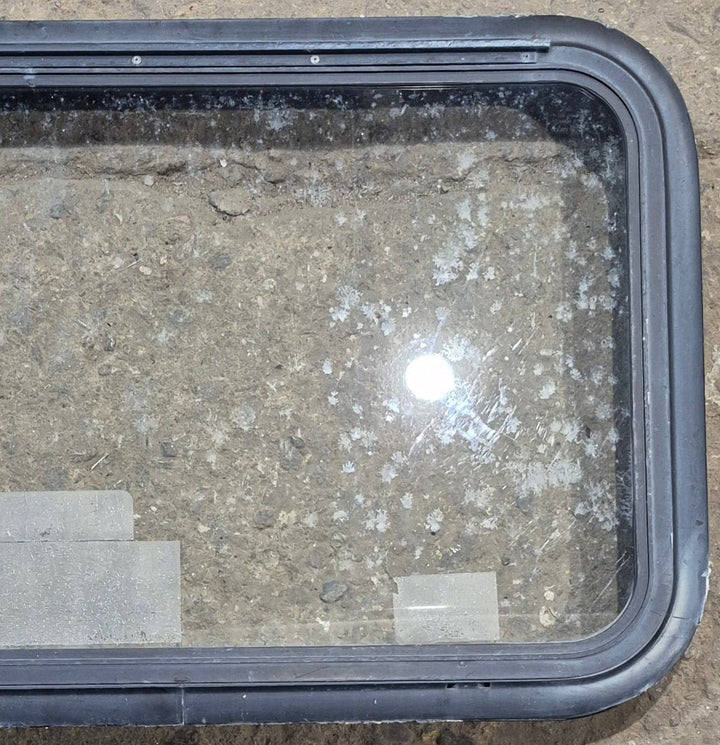 Used Black Emergency Radius Opening Window : 35 1/2" W x 18 3/4" H x 1 7/8" - Young Farts RV Parts
