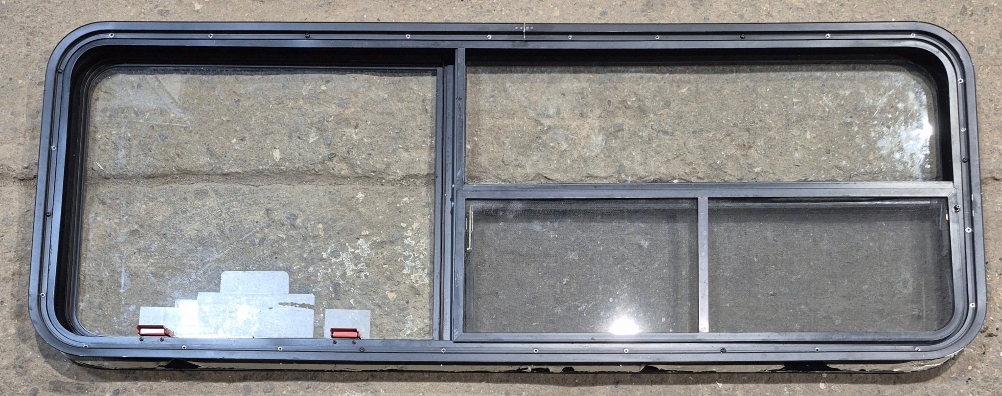 Used Black Emergency Radius Opening Window : 59 1/4" W x 21 1/4" H x 1 7/8" - Young Farts RV Parts