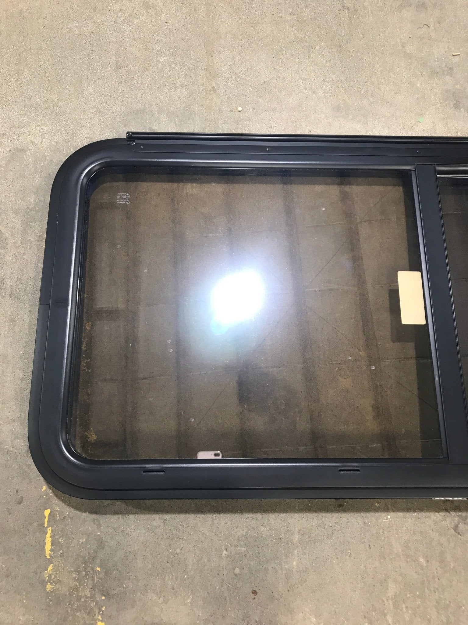 Used Black Radius Emergency Opening Window : 23 1/2" W x 39 1/2" H x 1 1/2" D - Young Farts RV Parts