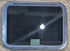 Used Black Radius Emergency Opening Window : 29 1/2" W x 21 1/2" H x 1 3/4" - Young Farts RV Parts
