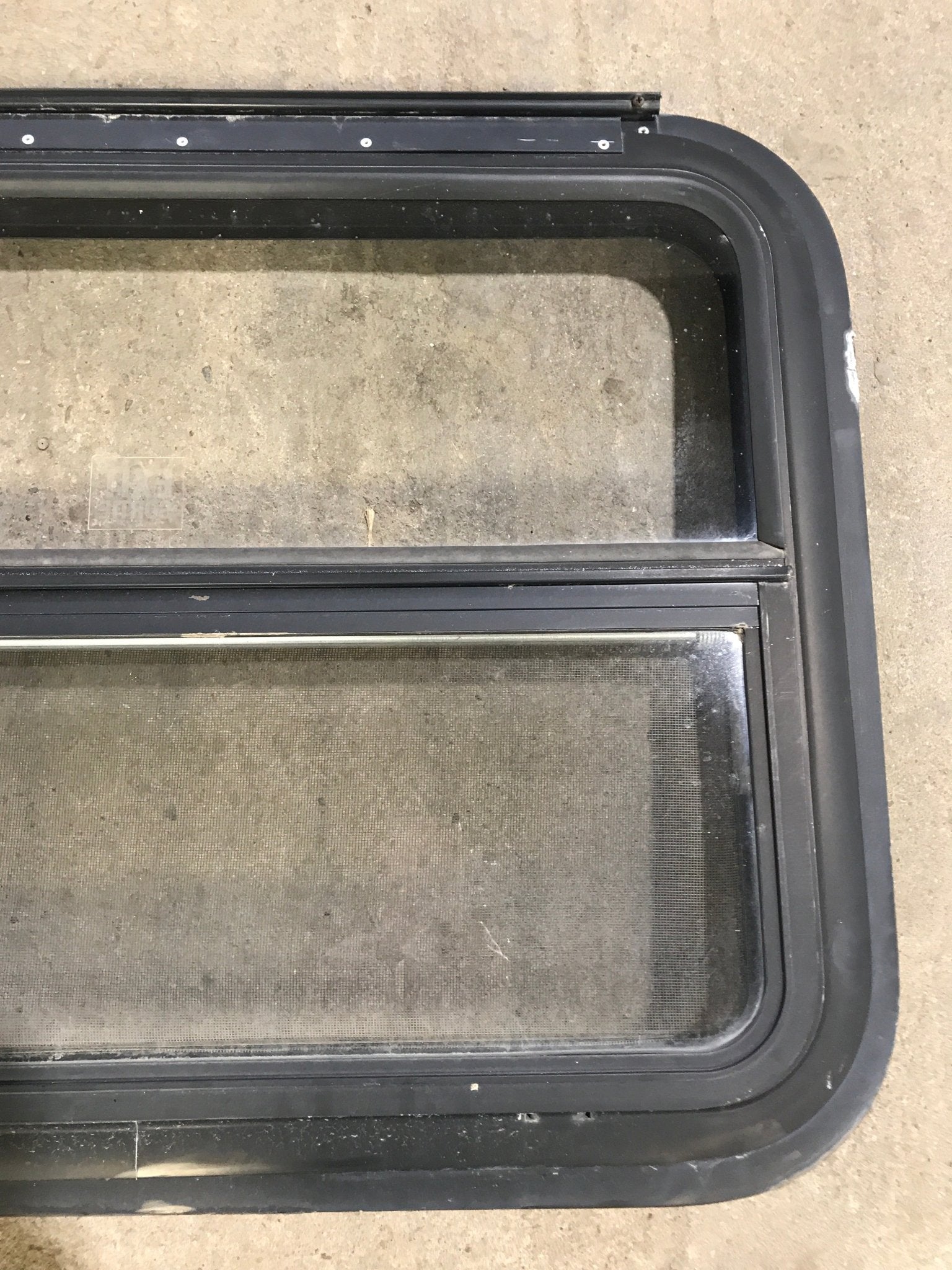 Used Black Radius Emergency Opening Window : 29 1/2" W x 21 1/2" H x 1 7/8" D - Young Farts RV Parts