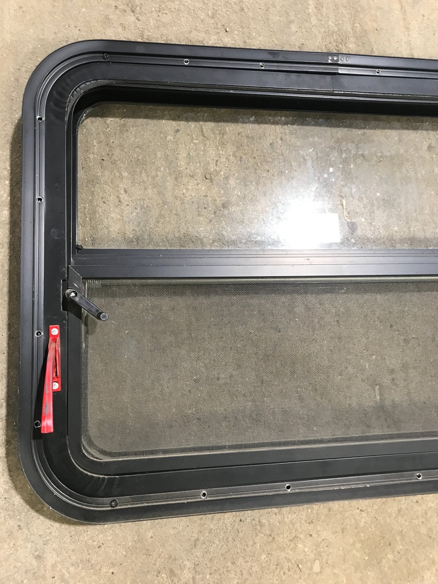 Used Black Radius Emergency Opening Window : 29 1/2" W x 21 1/2" H x 1 7/8" D - Young Farts RV Parts