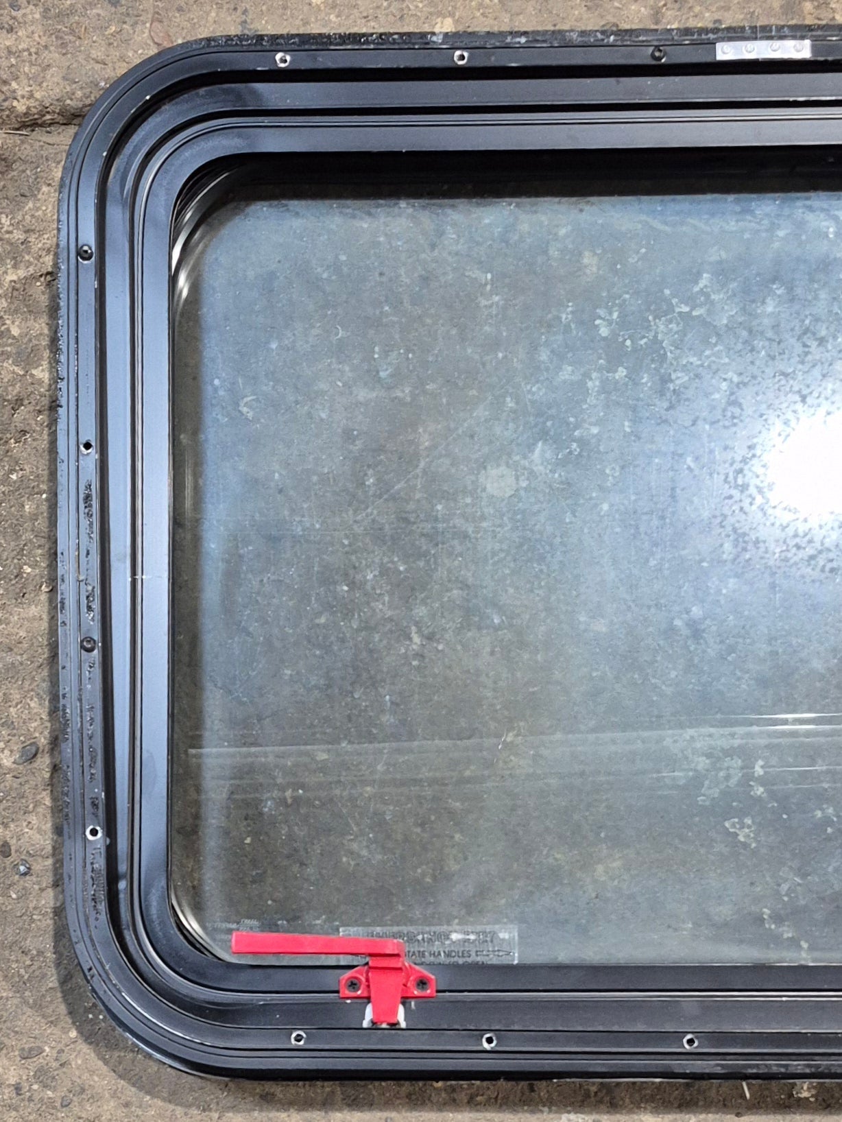 Used Black Radius Emergency Opening Window : 29 1/2" W x 21 1/2" H x 2" D - Young Farts RV Parts