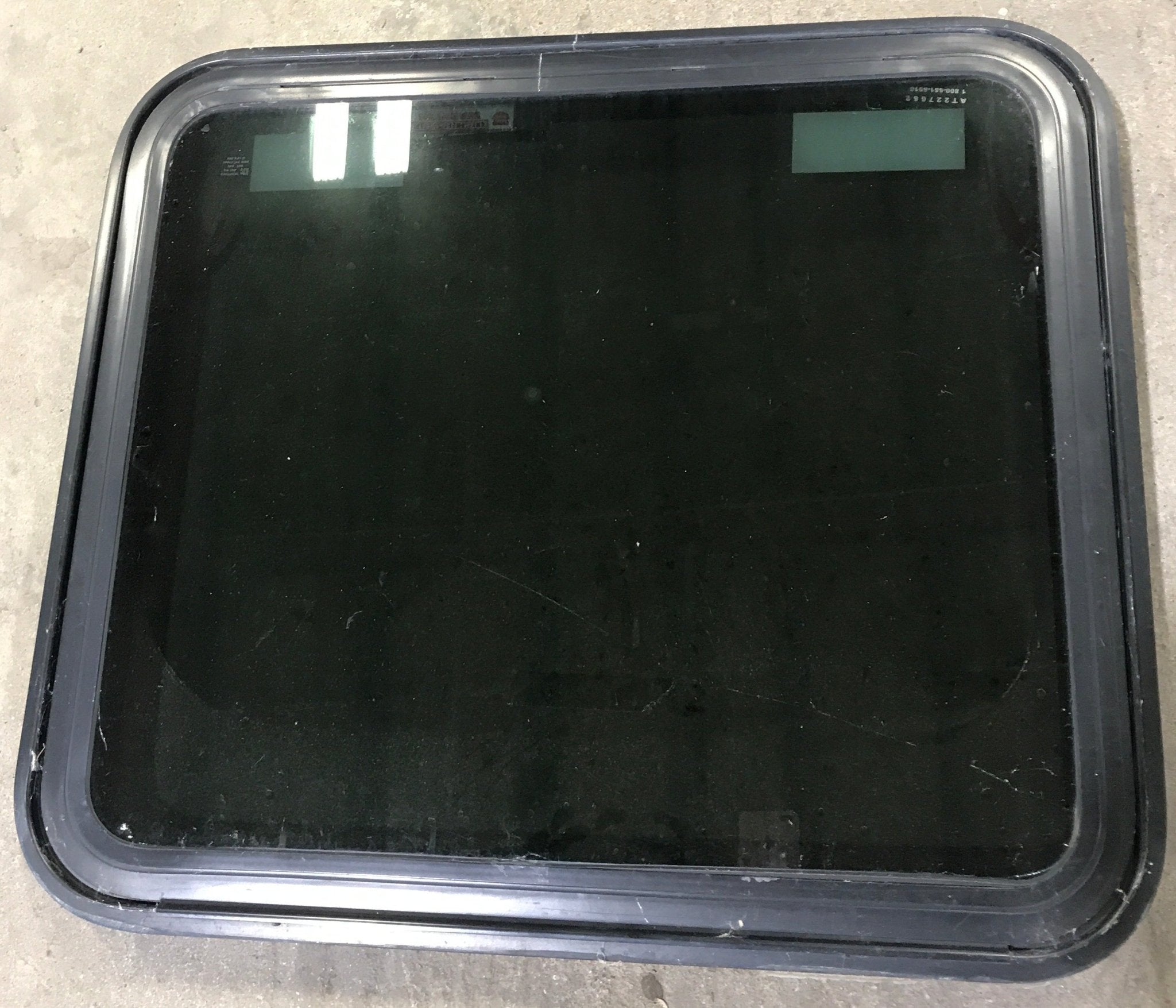 Used Black Radius Emergency Opening Window : 29 1/2" W x 25 1/2" H x 1 7/8" D - Young Farts RV Parts