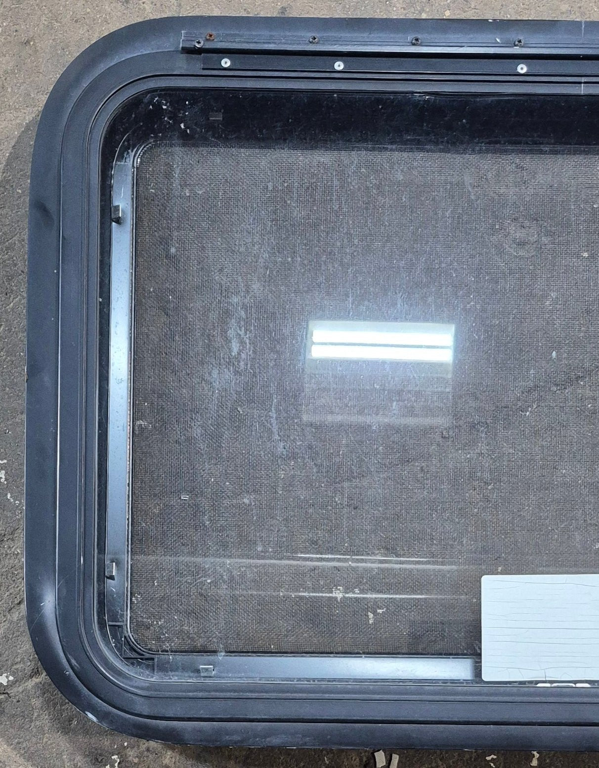 Used Black Radius Emergency Opening Window : 29 1/4" W x 19 1/4" H x 1 3/8" D - Young Farts RV Parts