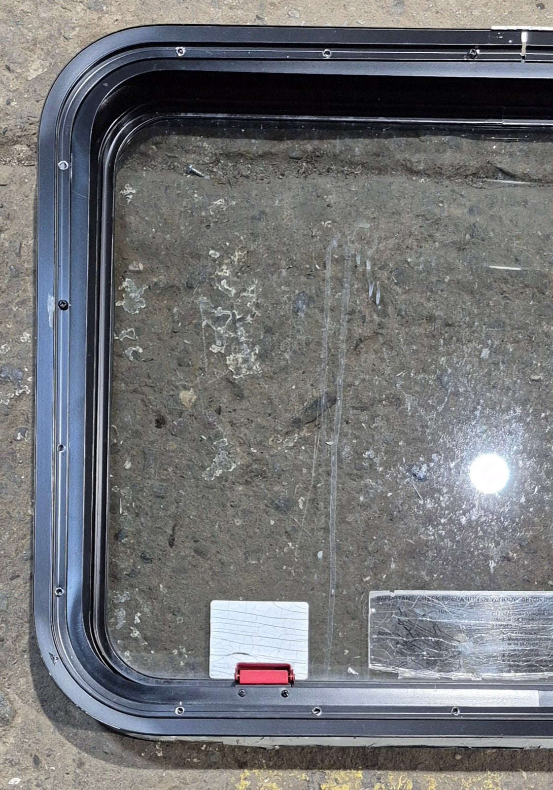 Used Black Radius Emergency Opening Window : 29 1/4" W x 21 1/2" H x 1 3/4" - Young Farts RV Parts