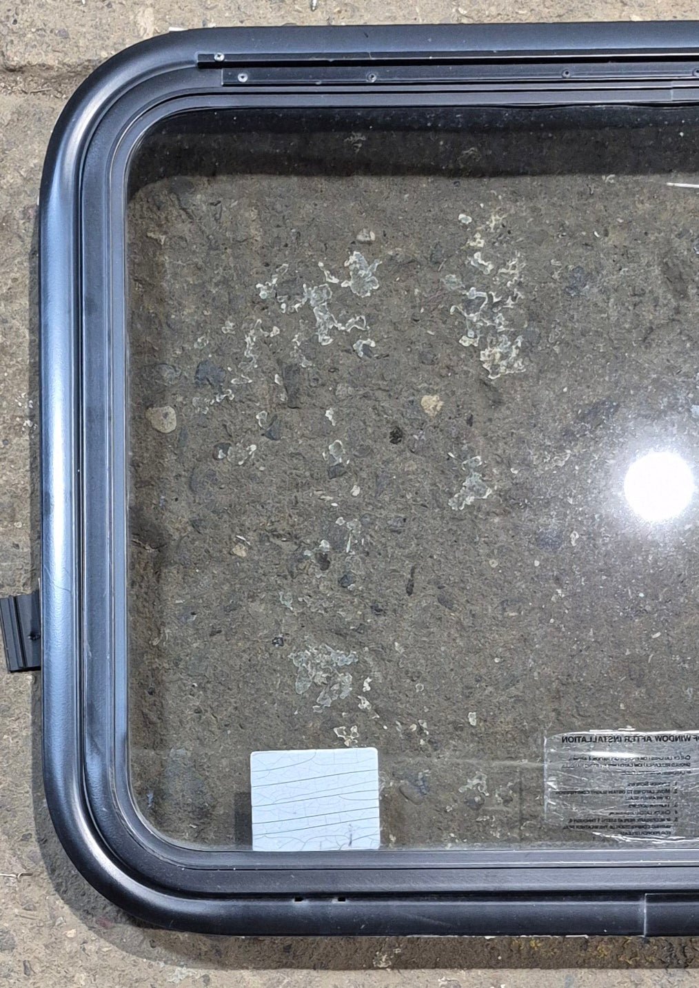 Used Black Radius Emergency Opening Window : 29 1/4" W x 21 1/2" H x 1 3/4" - Young Farts RV Parts