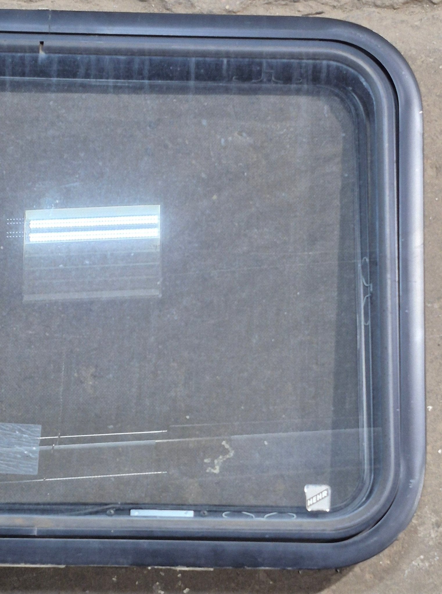 Used Black Radius Emergency Opening Window : 29 1/4" W x 21 1/2" H x 1 7/8" D - Young Farts RV Parts