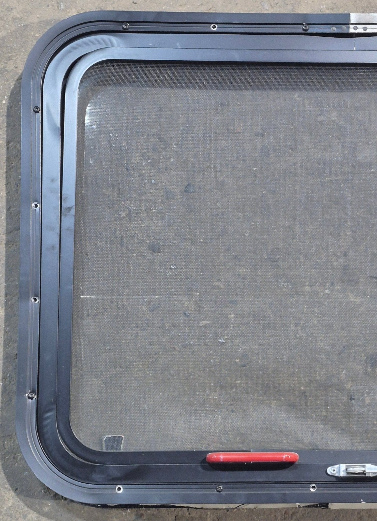 Used Black Radius Emergency Opening Window : 29 1/4" W x 21 1/2" H x 1 7/8" D - Young Farts RV Parts