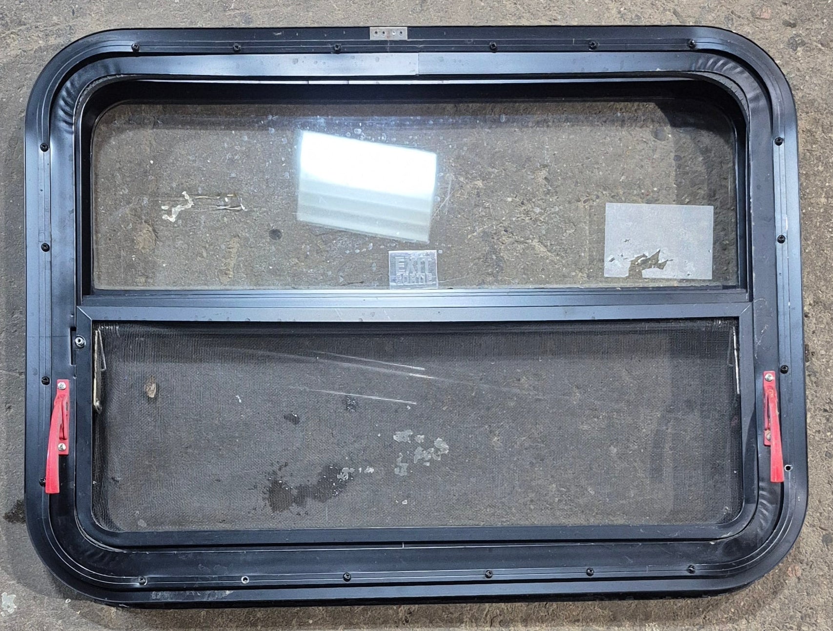 Used Black Radius Emergency Opening Window : 29 1/4" W x 21 1/4" H x 1 1/2" - Young Farts RV Parts